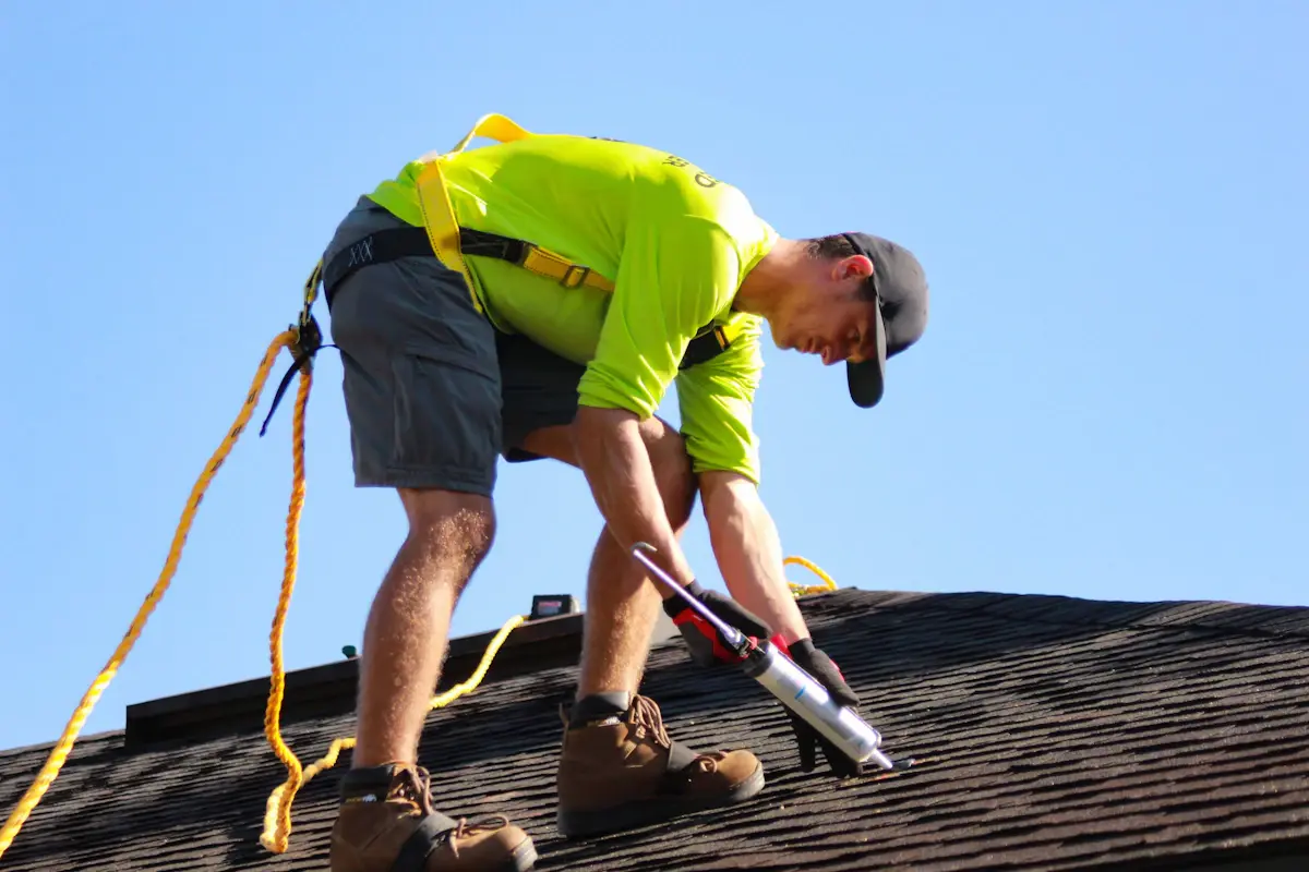 Roofer working on a residential roof installation